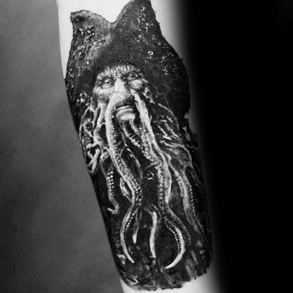 Tattoo of Davy Jones' mythical sea creature with tentacles on an arm