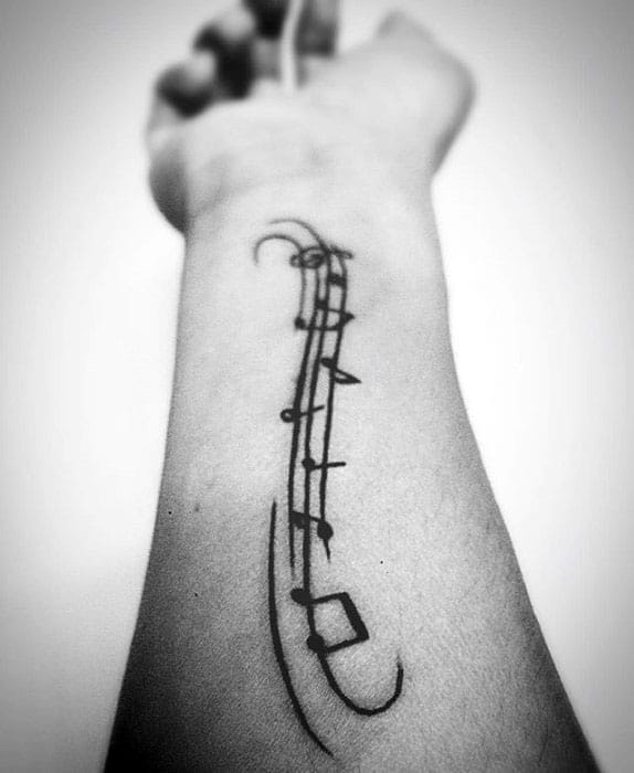 Inner Forearm Black Ink Simple Manly Music Staff Tattoo Design Ideas For Men