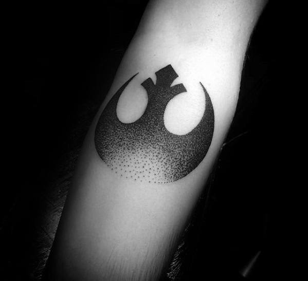 A tattoo of the Star Wars Rebel Alliance symbol on an arm