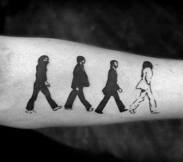 Silhouette tattoo of The Beatles crossing Abbey Road, with the last figure outlined instead of filled for contrast.