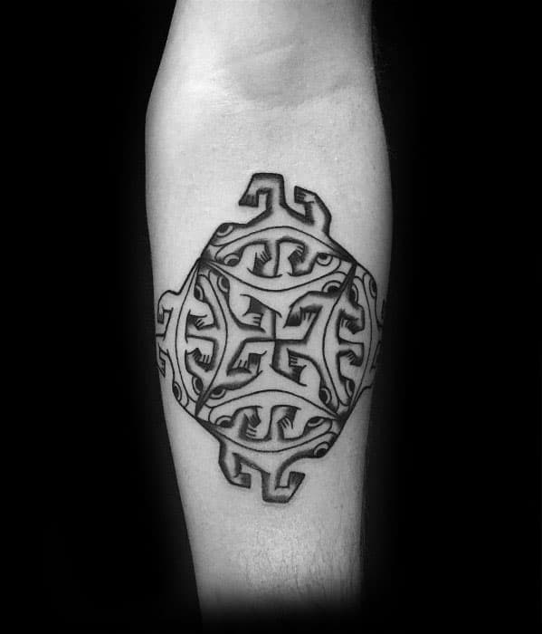 Tattoo of an MC Escher-inspired geometric pattern with interlocking, abstract lizard shapes forming a symmetrical circular design.