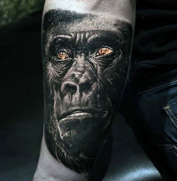 Inner Forearm Mens Tattoo Of A Gorilla In Black Ink With Orange Eyes