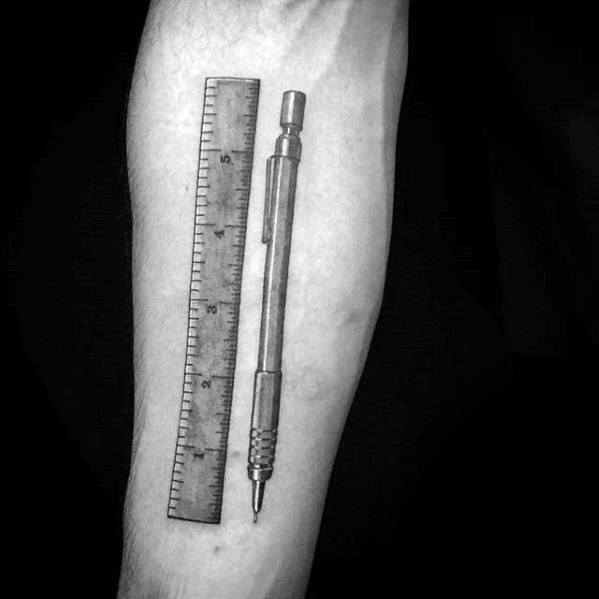 Tattoo of a ruler and pencil on a person's forearm, capturing the precision and creativity of an artist's tools