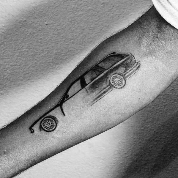 Minimalist BMW car tattoo on forearm, featuring fine line work with subtle shading for a sleek and stylish automotive design.