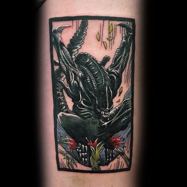 Stylized Xenomorph tattoo framed in a rectangle, showing the creature leaping with claws out and splashes of red and yellow accents.