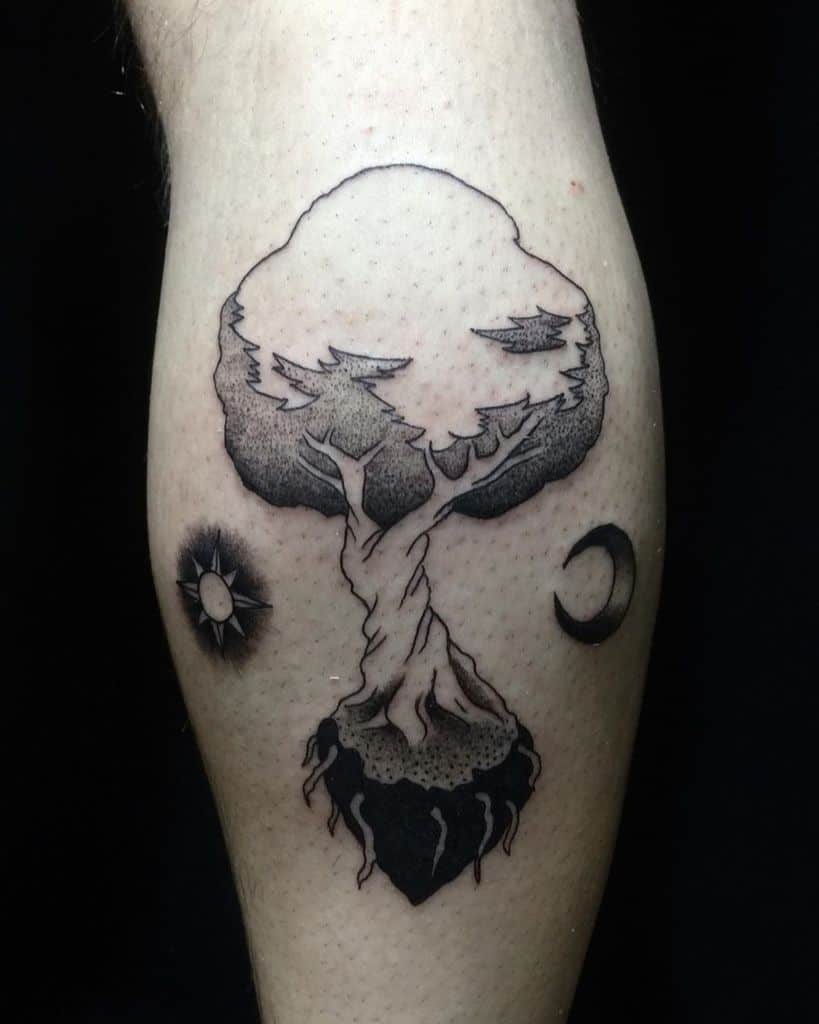 A floating tree of life tattoo, symbolizing balance and cosmic connection, with the sun and moon representing the duality of existence.