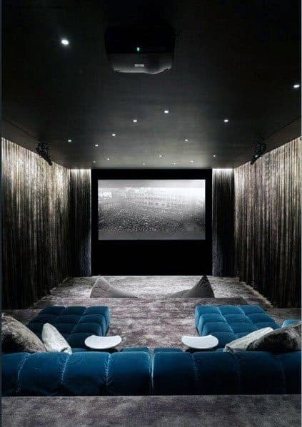 small home theater with blue sofa 