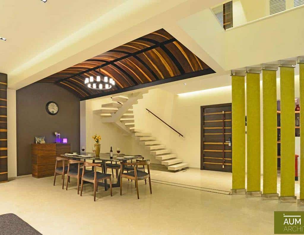 abstract dining room green pillars curved roof chandelier