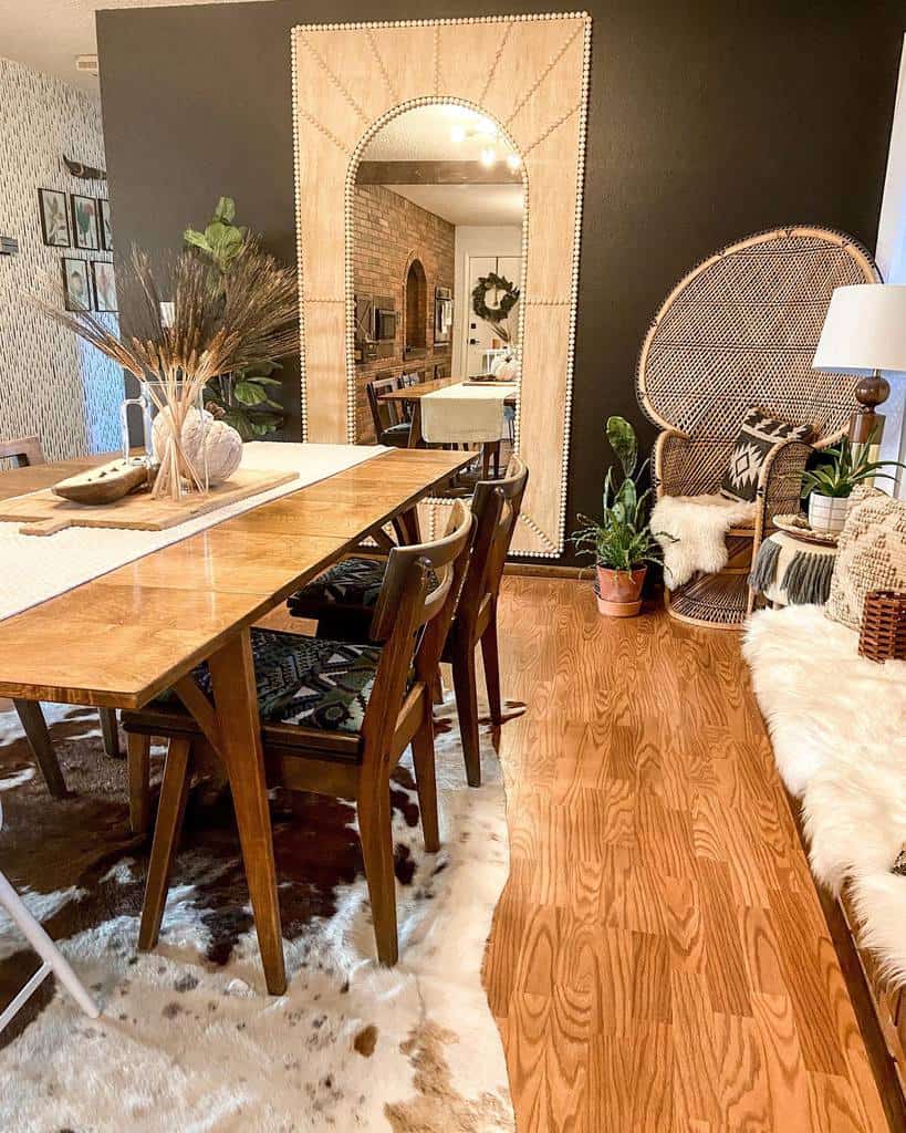 boho dining room large wall mirror wicker chair dining room table and chairs pot plants