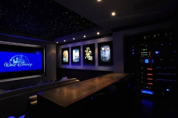 home theater with movie poster wall art