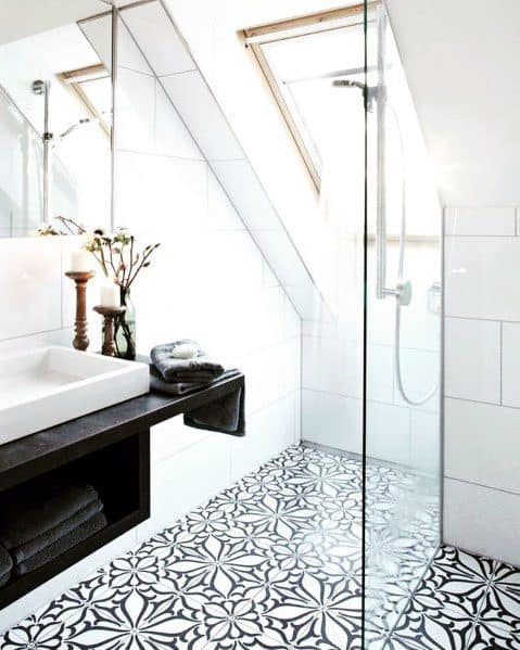 attic bathroom walk-in shower black and white pattern floor tiles candlesticks