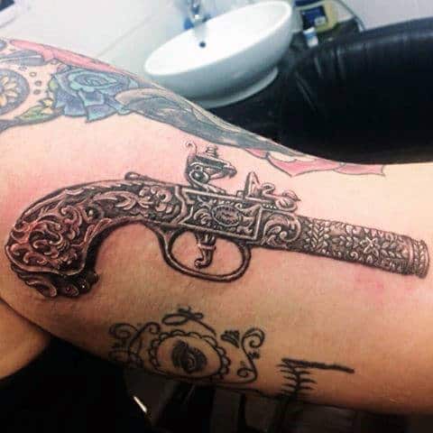 Intricate Revolving Pistol Tattoo On Forearms For Male