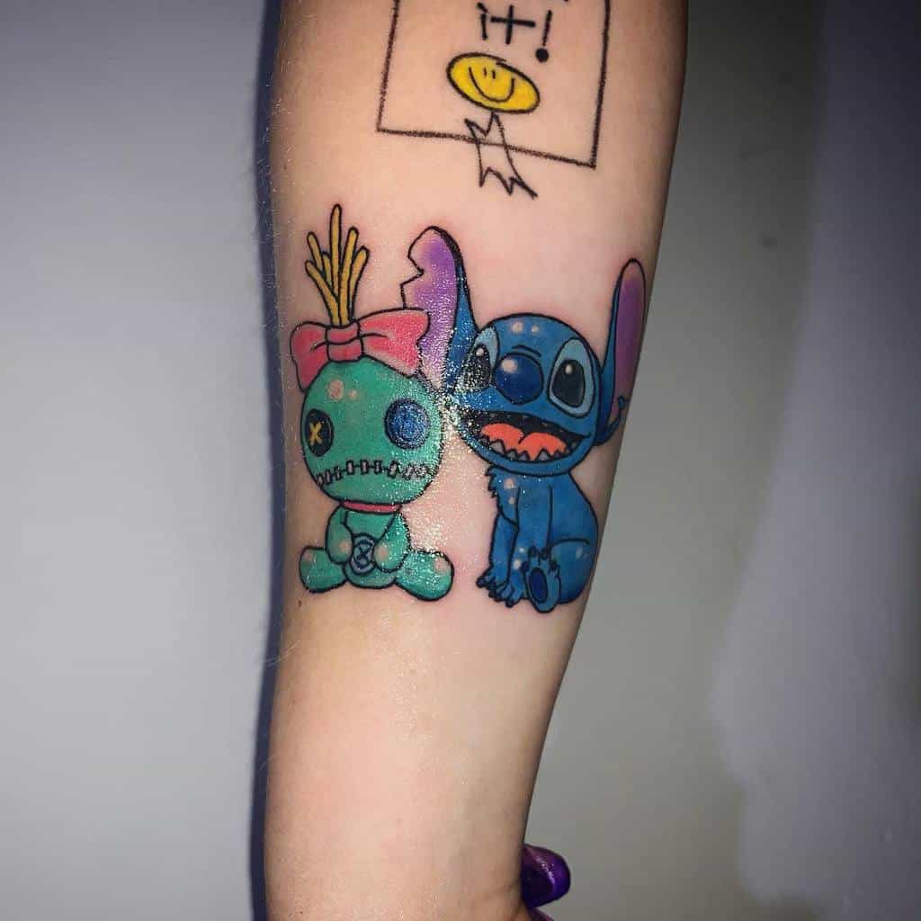 Colorful tattoo of Stitch and Angel (from Lilo & Stitch) with Angel wearing a bow and Stitch with a playful expression, on the forearm.