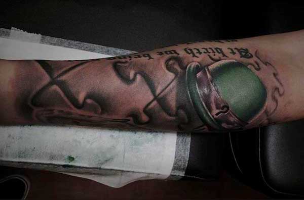 Irish Puzzle Piece Tattoo For Men On Forearm With Green Hat