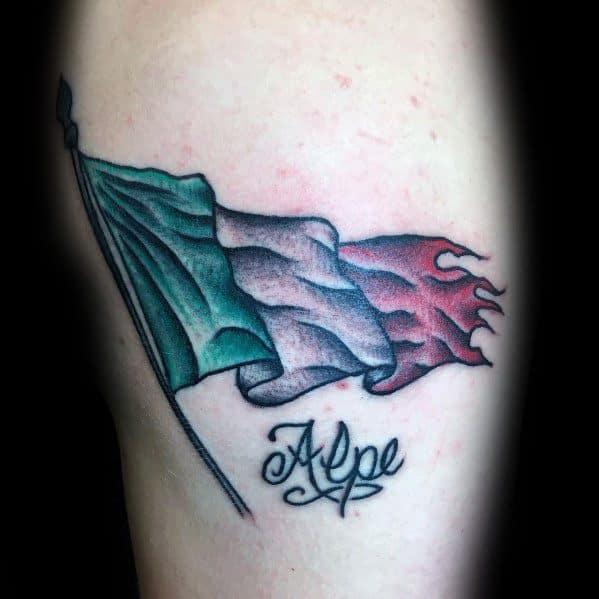 Tattoo of a waving Italian flag with a tattered end, symbolizing resilience and pride, with the word "Alpe" elegantly scripted below.