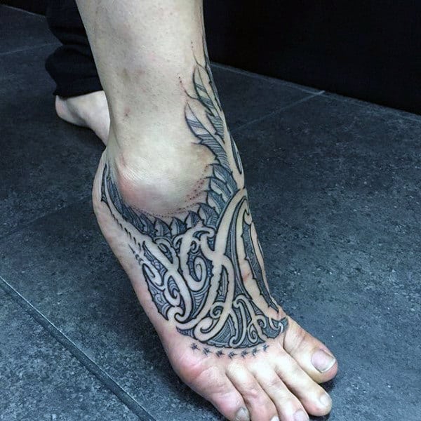 Italicized Black Tattoo Design on a Foot