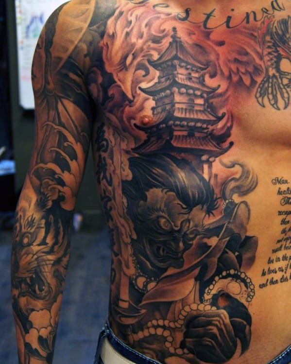 Man with detailed, oriental-themed tattoos covering his torso and upper arms