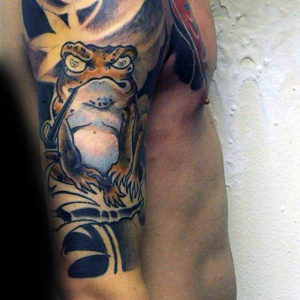 Japanese-style upper arm tattoo featuring a wise-looking frog sitting in a meditative pose, surrounded by bold black ink waves and a radiant sun.