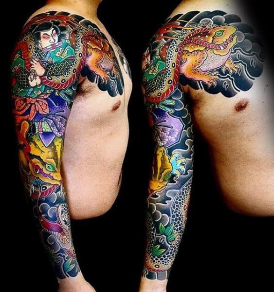 Japanese-style full-sleeve tattoo featuring a vibrant warrior frog, a fierce dragon, and a traditional samurai, surrounded by swirling clouds and waves.