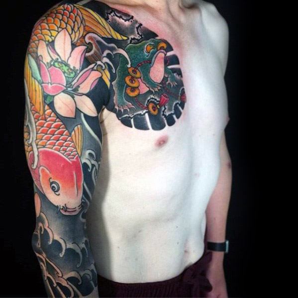 Japanese-style full-sleeve and chest tattoo featuring a vibrant koi fish, lotus flowers, and a mystical frog surrounded by traditional wave patterns.