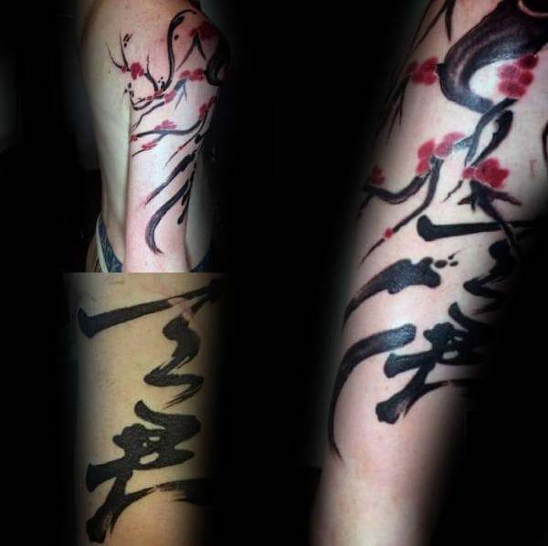 Watercolor-style arm tattoo featuring bold Japanese calligraphy, flowing black ink strokes, and delicate red cherry blossoms on branches