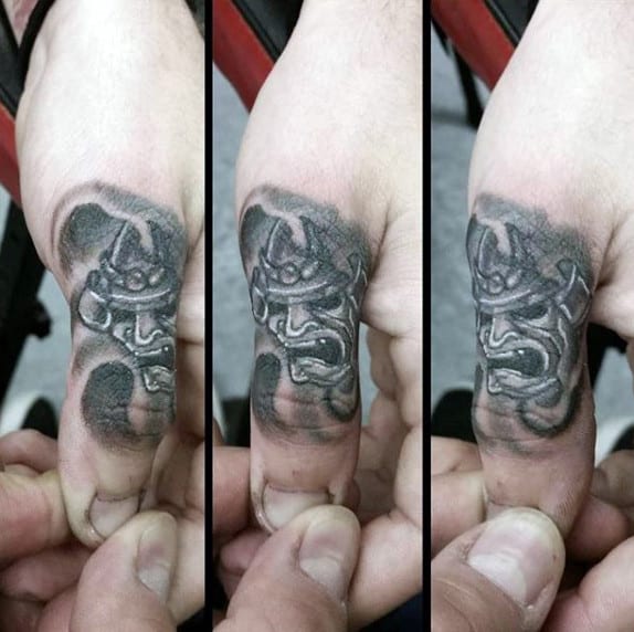 Japanese Mask Thumb Tattoos For Guys