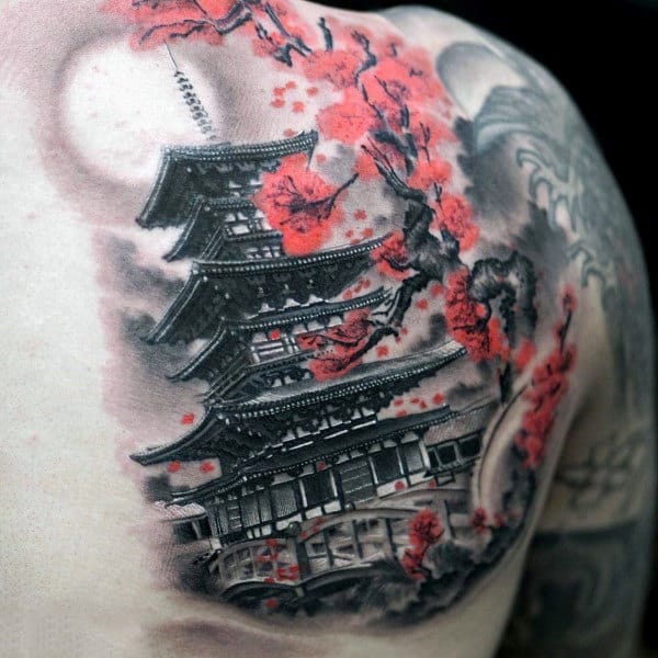 Tattoo of a pagoda and cherry blossoms on a back