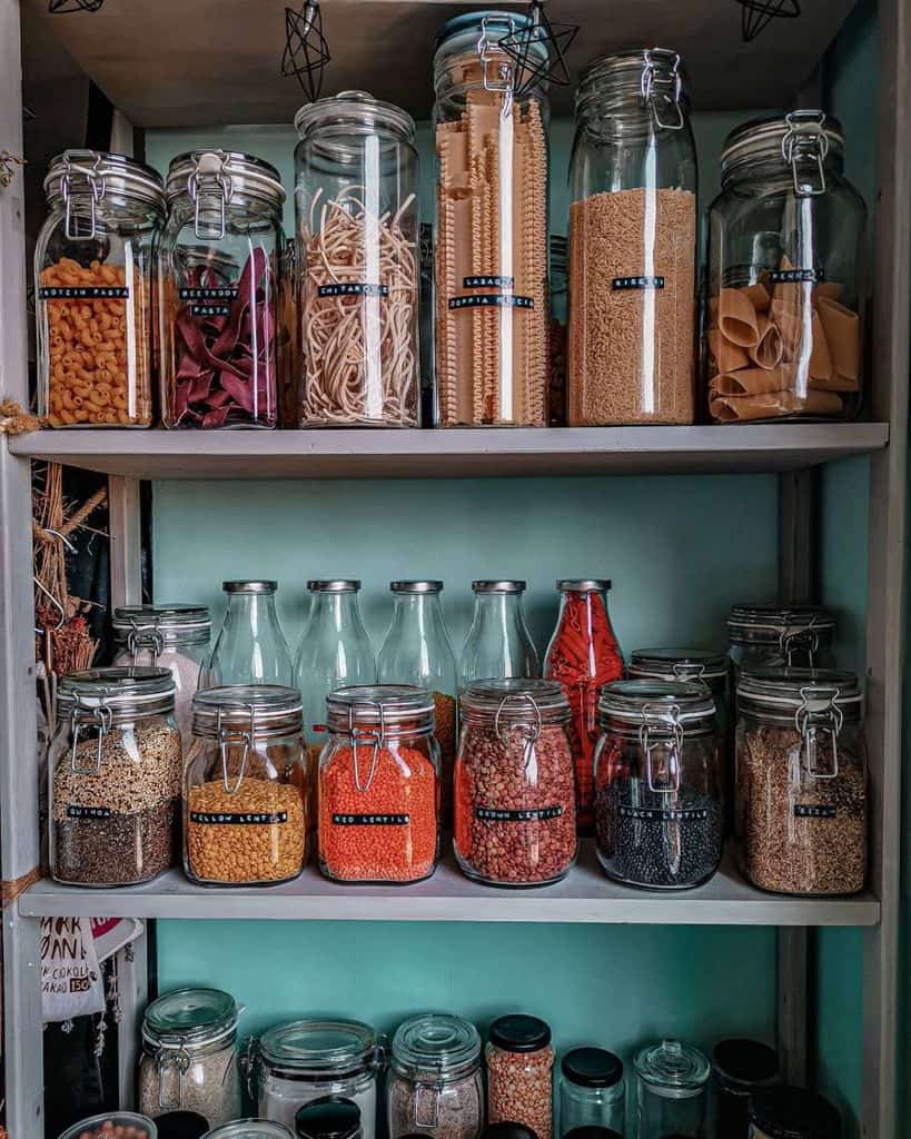 jars on kitchen shelf holding pasta and spices