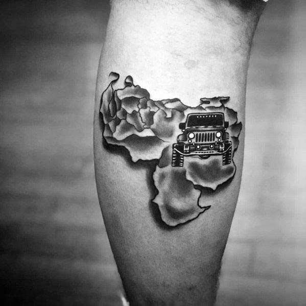 Black and grey tattoo of a Jeep emerging from a cracked map of Africa, symbolizing adventure and off-road exploration.