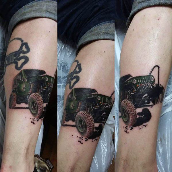 Realistic tattoo of a green off-road Jeep with detailed shading, appearing to drive out of the skin with a rugged, 3D effect.