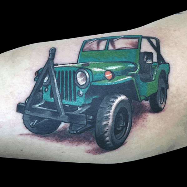 Colorful tattoo of a classic green Jeep with detailed shading, giving it a realistic off-road look, placed on the arm.