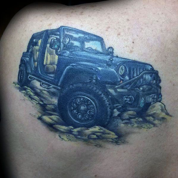 Realistic tattoo of a black Jeep Wrangler navigating rocky terrain, featuring detailed shading and depth for a rugged off-road look.