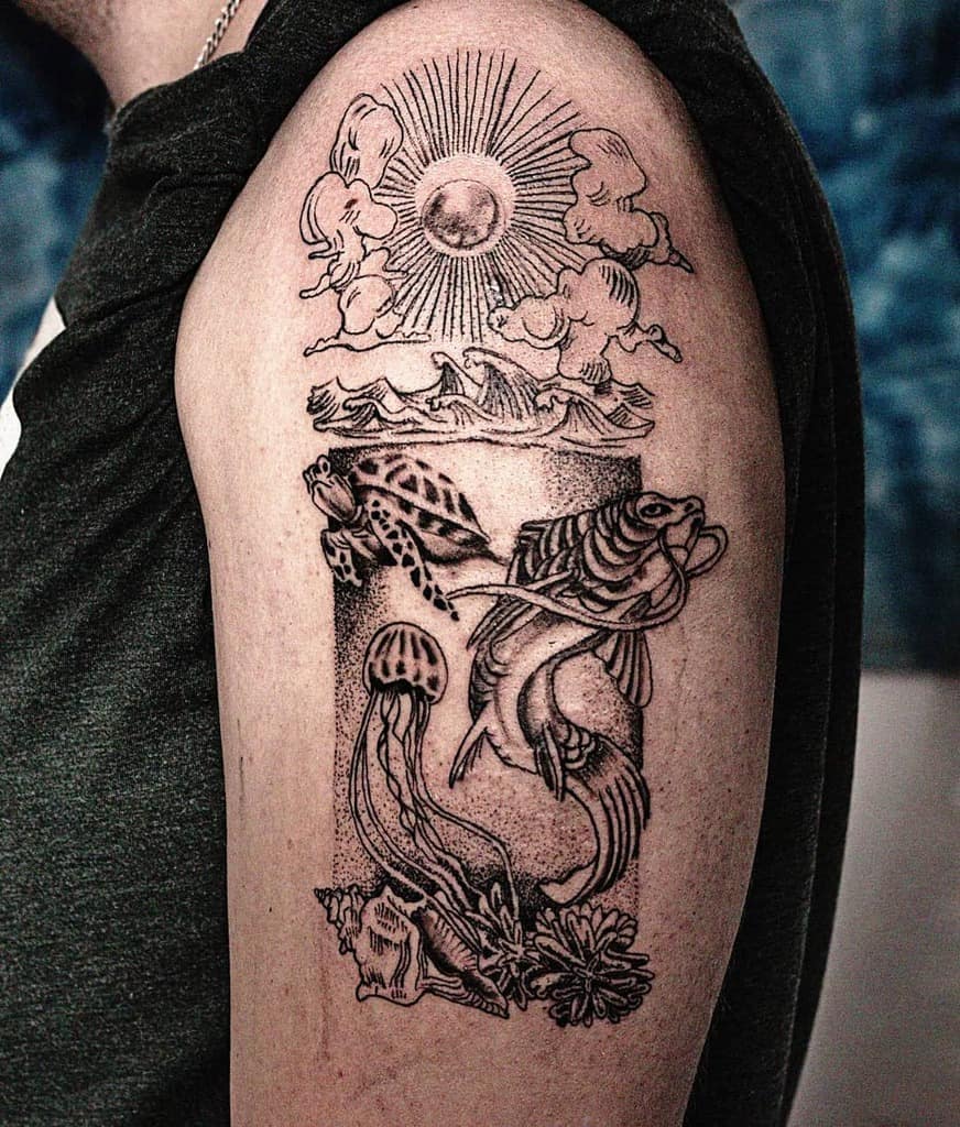 Detailed ocean-themed tattoo featuring the sun, clouds, waves, a sea turtle, fish, jellyfish, and underwater coral