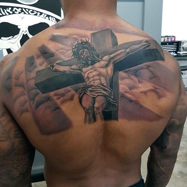 Jesus Cross With Clouds And Sun Rays Male Back Tattoo