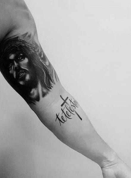 Jesus Portrait With Tetelestai And Corss Mens Arm Tattoo