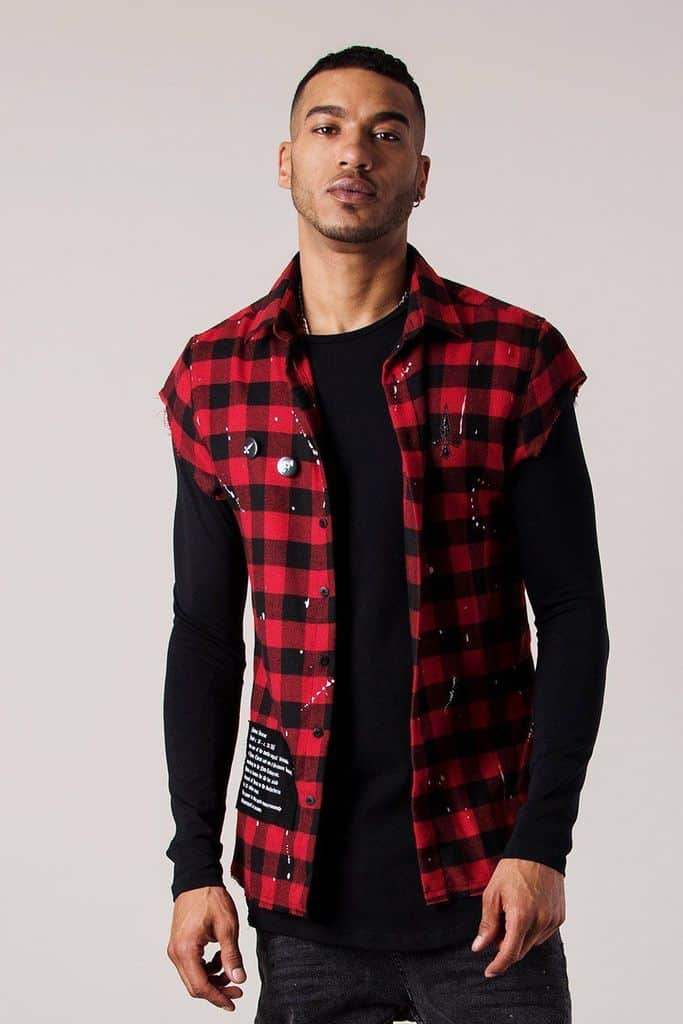 Man wearing oversized cut-off plaid shirt