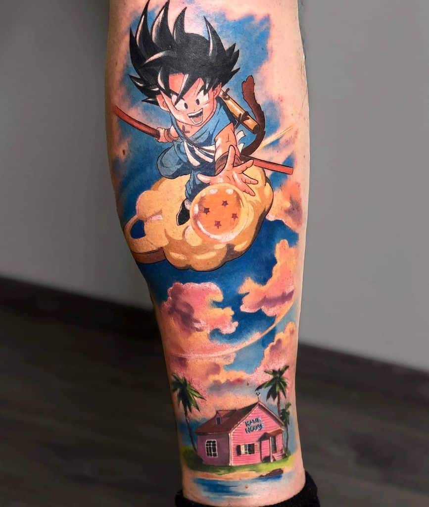A colorful tattoo of young Goku riding the Nimbus cloud, holding a Dragon Ball, with the Kame House in the background and a vibrant sky.