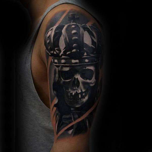 King Skeleton With Crown Black Ink Upper Arm Male Tattoo