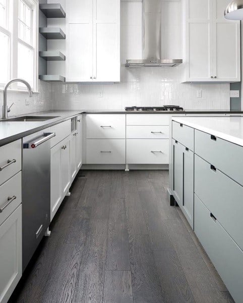 Glossy white subway tiles create a clean and bright kitchen backsplash.