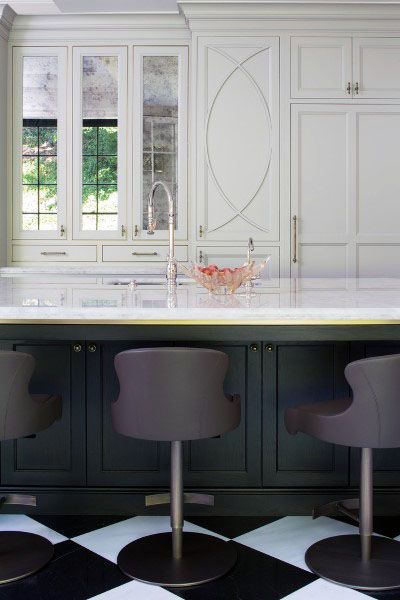 luxury kitchen black island with marble countertop black and white check floor tiles 