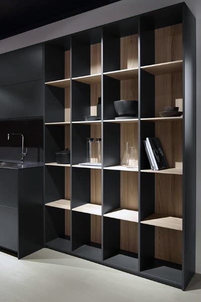A sleek and modern open pantry design featuring black frames with wood accents, perfect for stylish storage and display.
