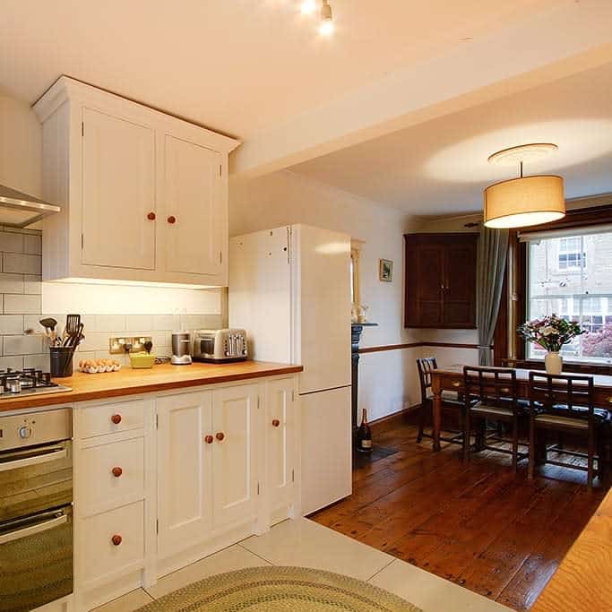 white cabinet kitchen open plan dining room