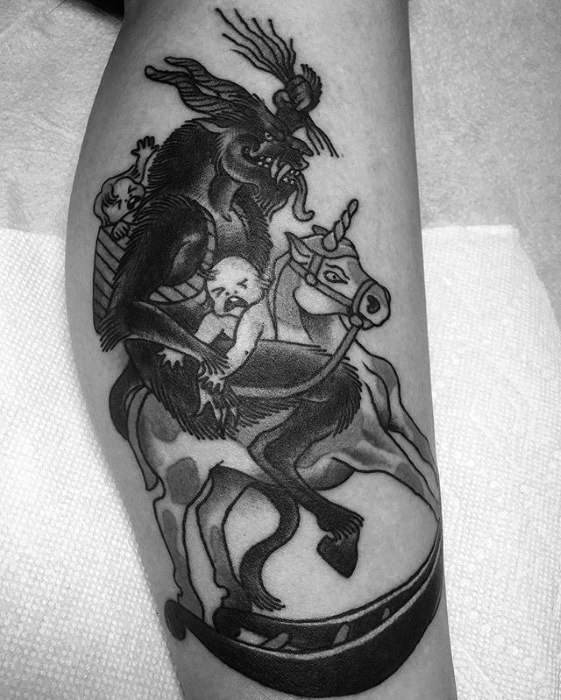 Black and grey Krampus tattoo showing the demon riding a carousel horse while holding a distressed child, with another child in a basket.