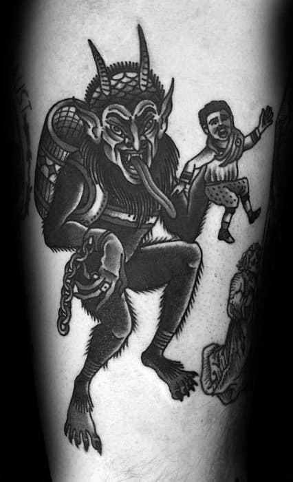 Black and grey Krampus tattoo showing the demon with a child in one hand and a basket on his back, sticking out his long tongue.