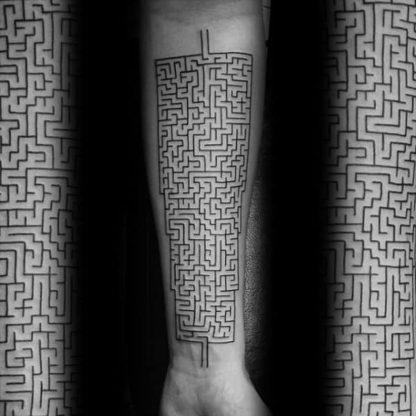 Minimalist black ink labyrinth tattoo covering a man's forearm, featuring an intricate rectangular maze design with clean, precise lines.