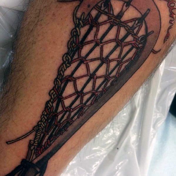 Realistic lacrosse stick tattoo with intricate netting details and bold shading, placed on the forearm for a striking and athletic design.