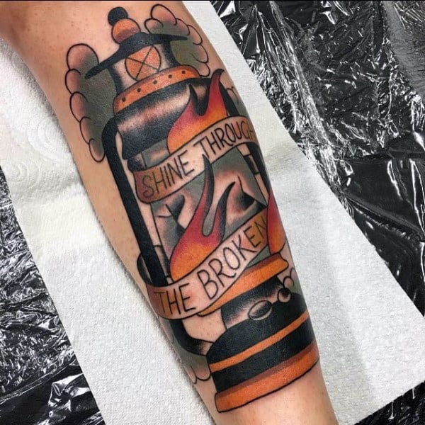 Lantern Shine Through The Broken Shin Tattoo On Man
