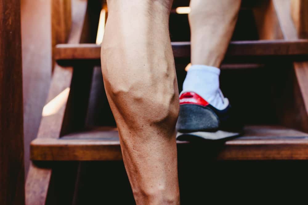 young man large visible veins of calf muscles