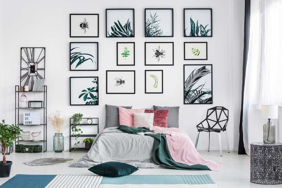 framed drawings on bedroom wall 
