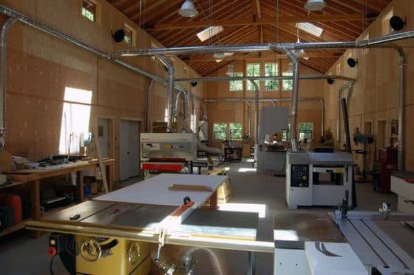 large wood workshop with saws and dust collection systems